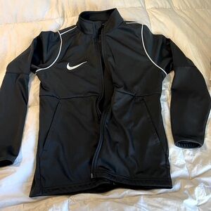 Youth unisex Nike zip up jacket. Brand New! Size Small/ fits like a size 7.